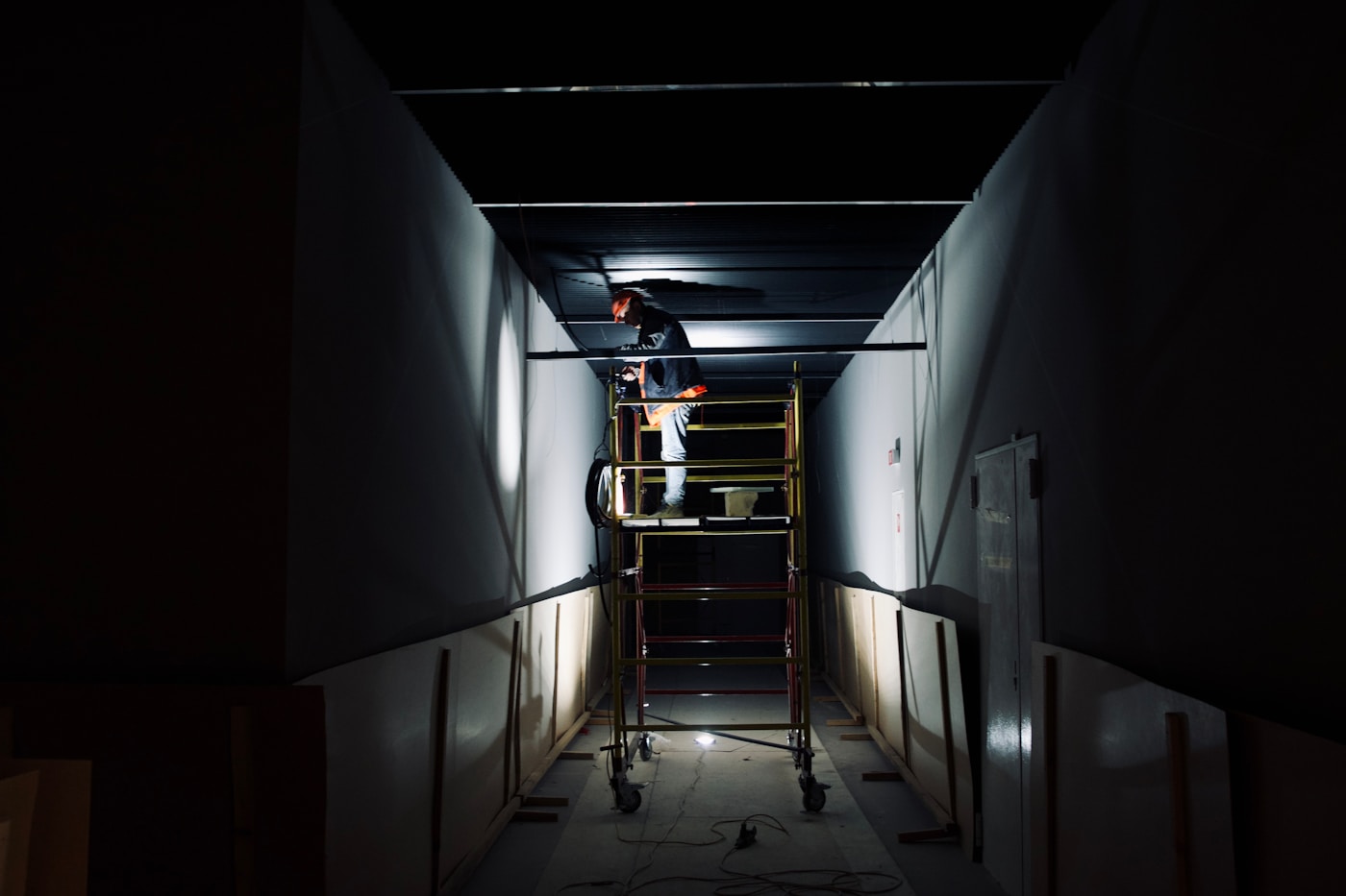 Ceiling drywall work on a ladder during a Kentwood repair