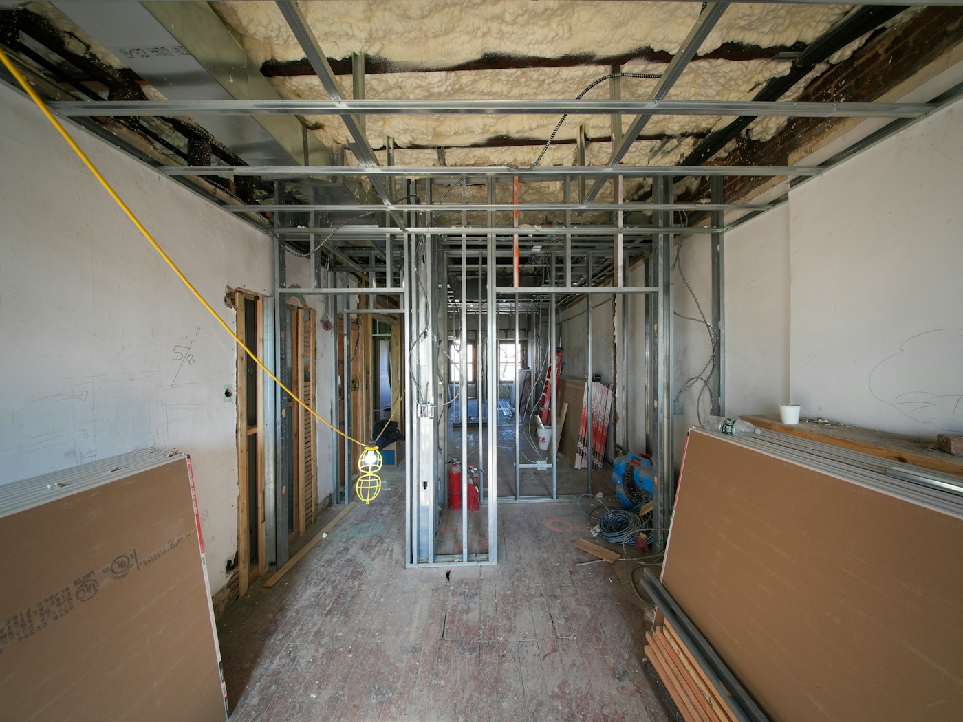 Commercial metal stud framing and drywall panels in a tenant build-out