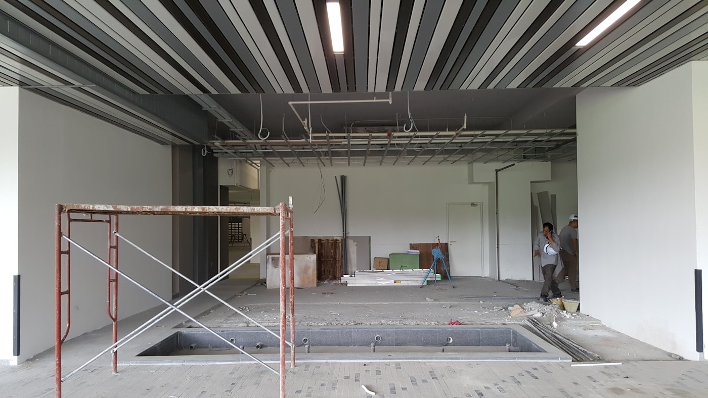 Large empty building interior during water damage drywall assessment in Grand Rapids